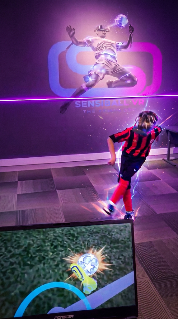 Young football player training with SensiBallVR immersive cognitive system