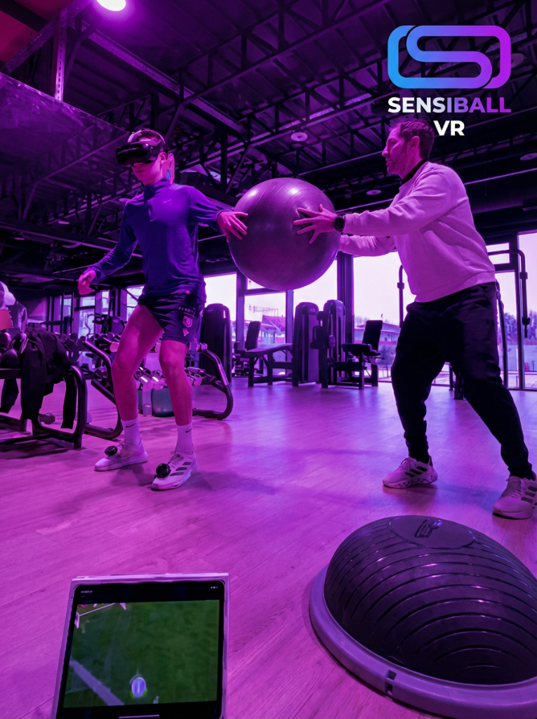 Football player wearing VR headset during rehabilitation training with coach assistance